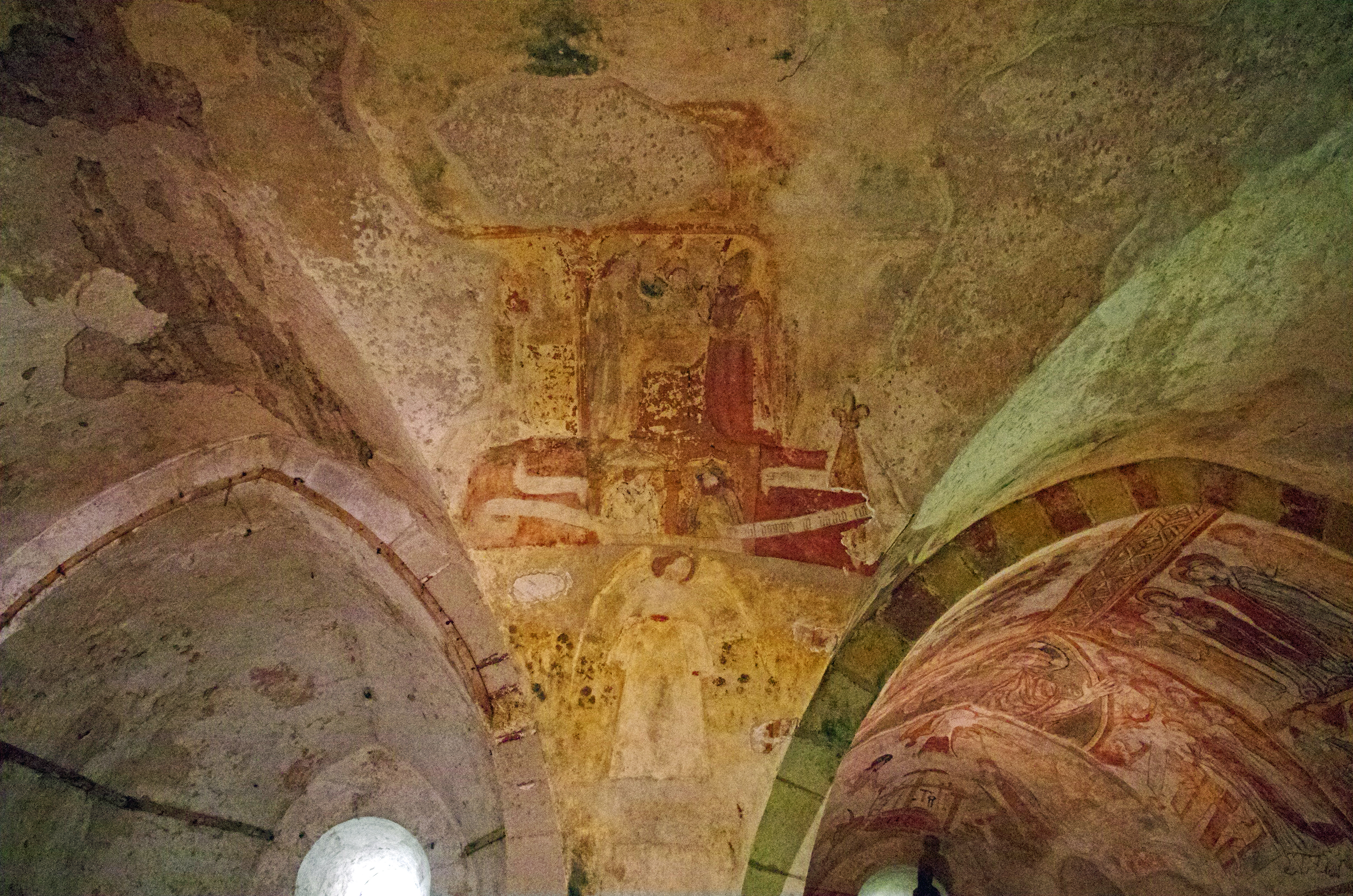 Ancient frescoes on a Romanesque church ceiling